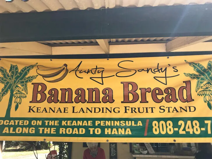 sign that says aunty sandy's banana bread with location and phone number