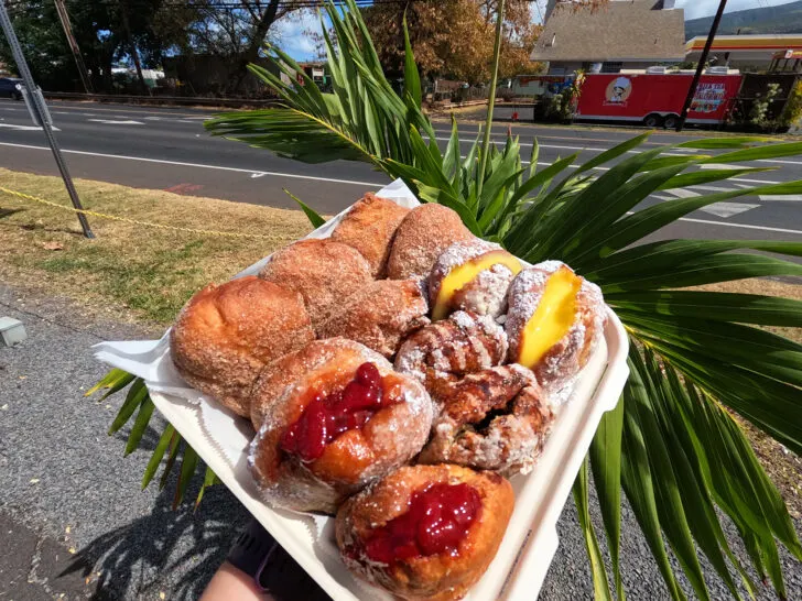 to go container with an assortment of malasadas best restaurants in maui hawaii