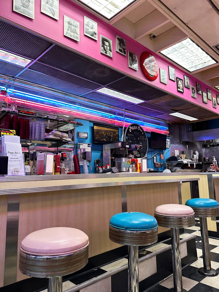 classic diner with pink and blue barstools and decorations