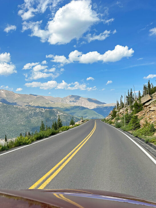 view of the road and mountains in the distance in Rocky Mountain national park CO