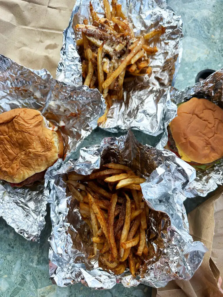 cheeseburgers and fries on tin foil Shupes Christiansted