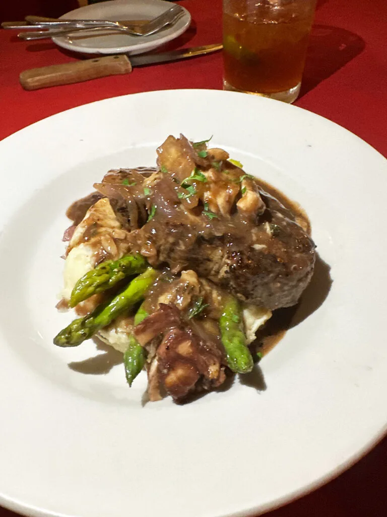 steak mashed potatoes and asparagus on plate at Duggan's