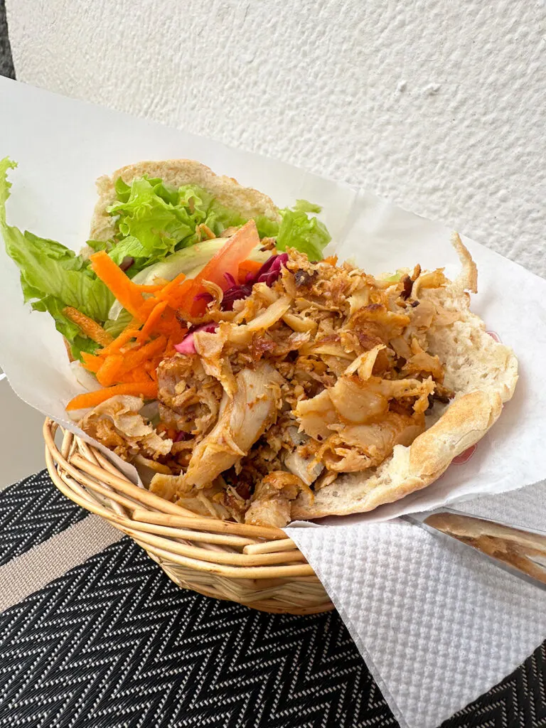 where to eat in Lagos Portugal picture of basket of chicken with pita and veggies