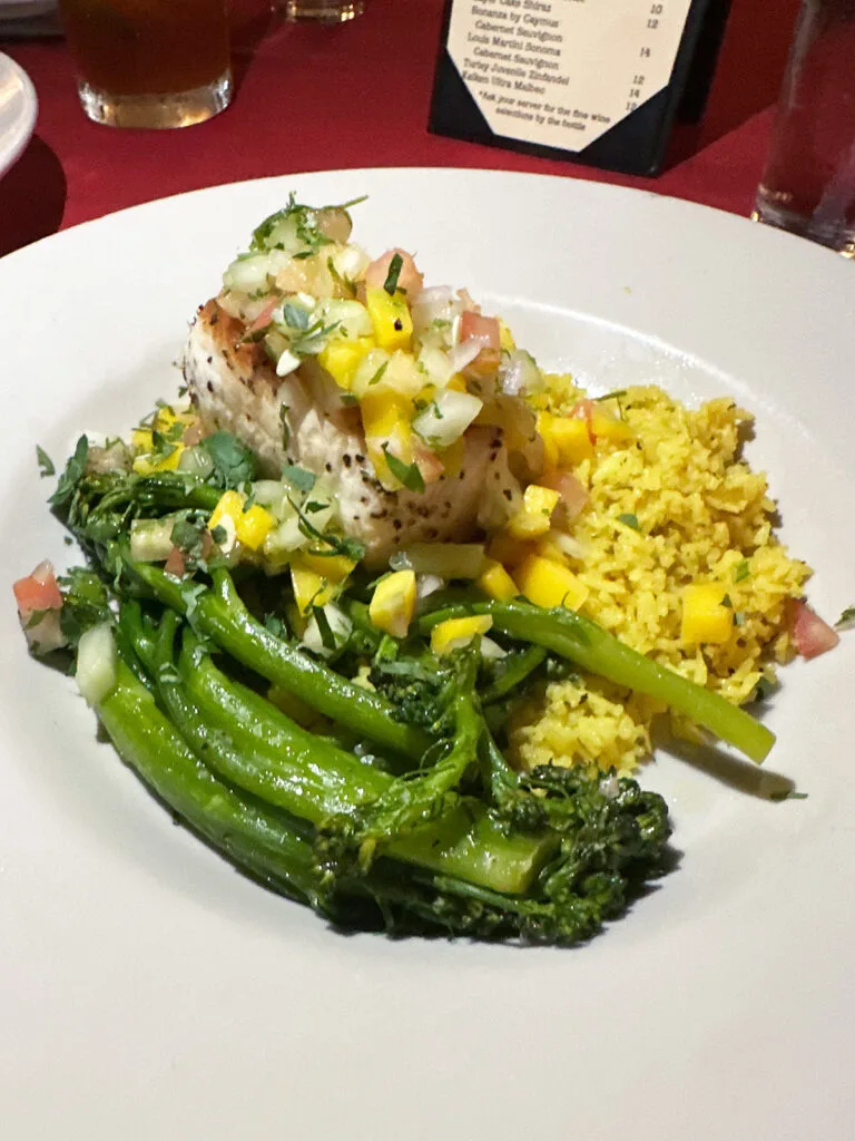 amazing fish rice and broccoli on white plate