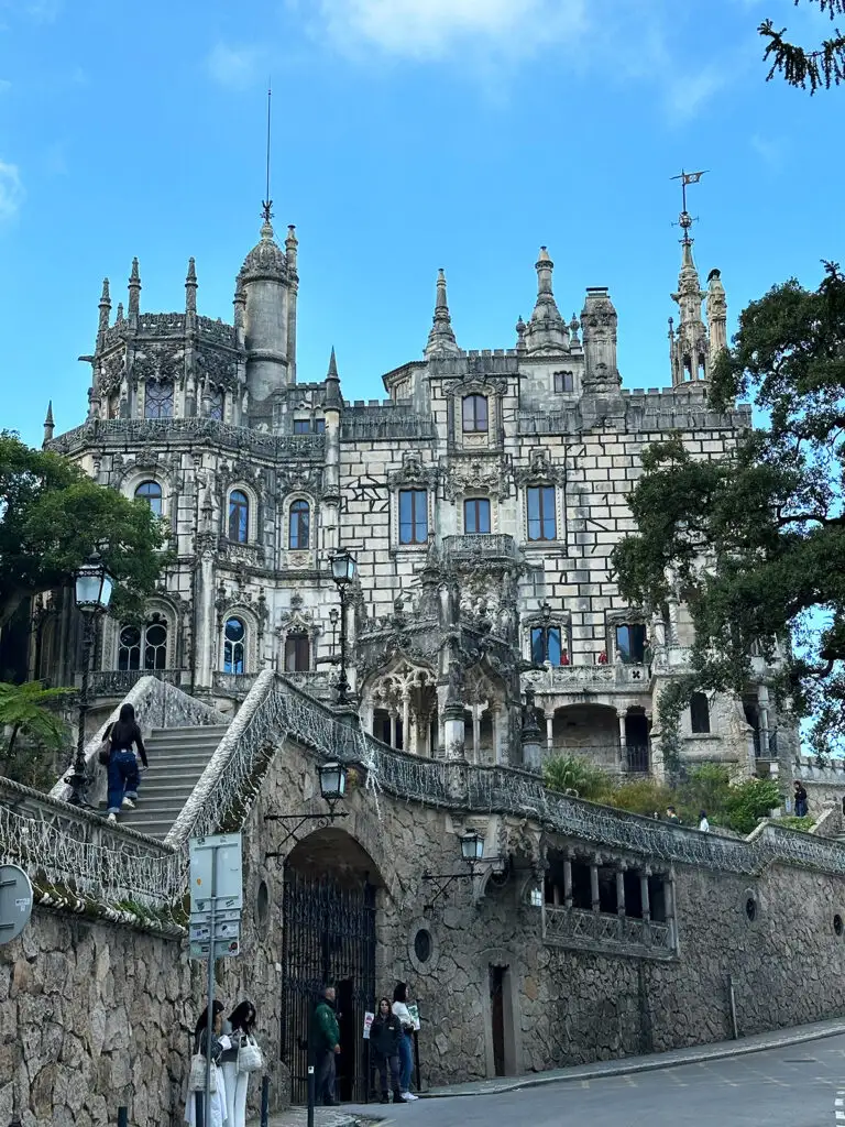 ornate castle exterior with blue sky and lots of window