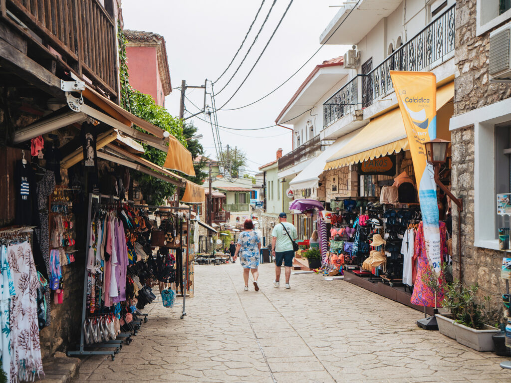 view of shops with clothing and accessories in cute Greece village
