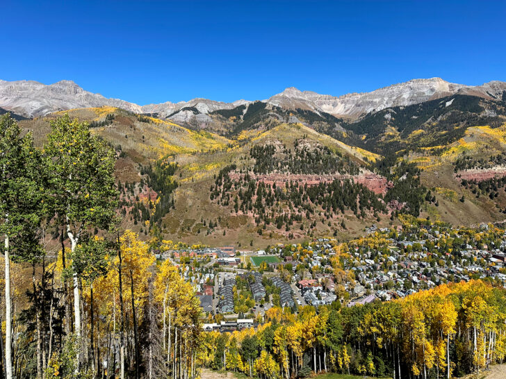 view of colorful mountains with yellow and green trees during the fall in Telluride Colorado