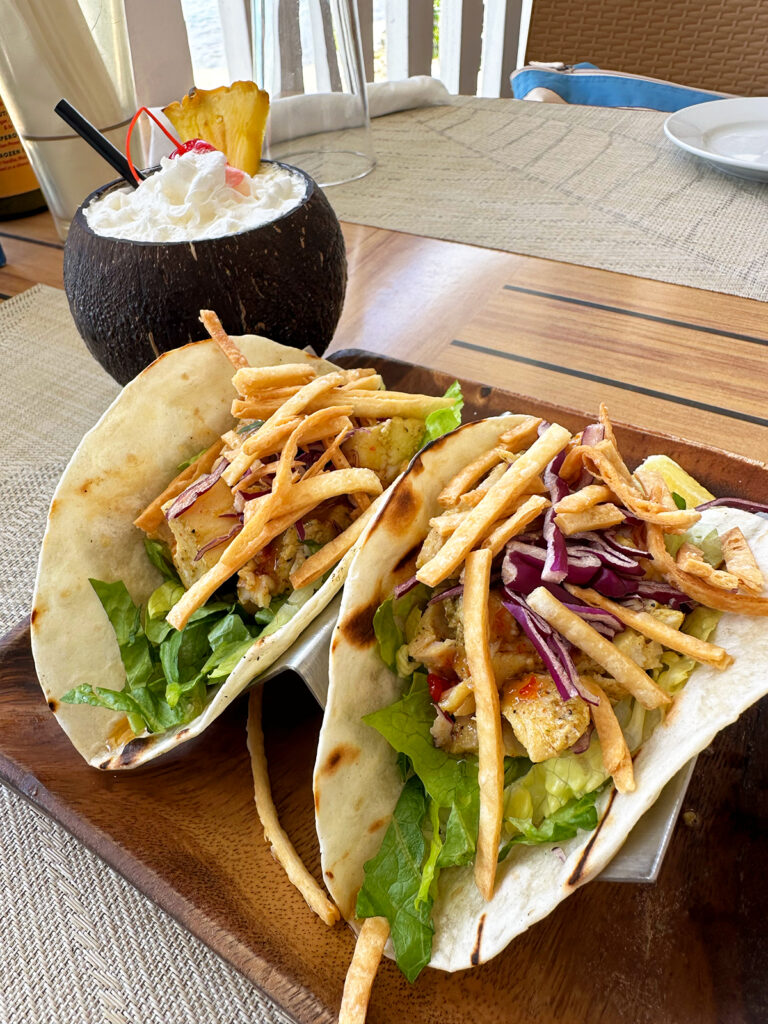 two mahi mahi tacos with coconut drink