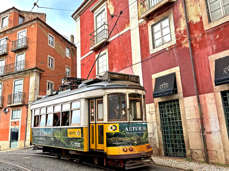 visiting Portugal in November view of street car with red buildings behind