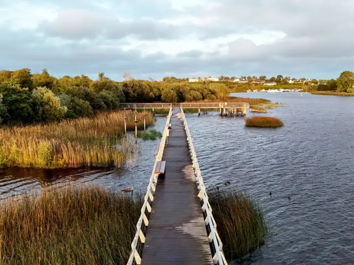 things to do in county leitrim Ireland with view of boardwalk over water and grass